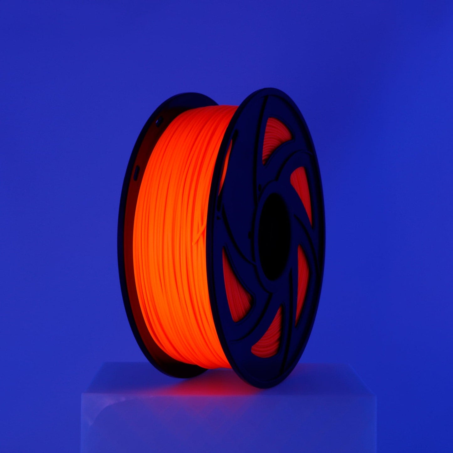 Fluorescent Orange PETG Filament 1.75mm shown under UV lights