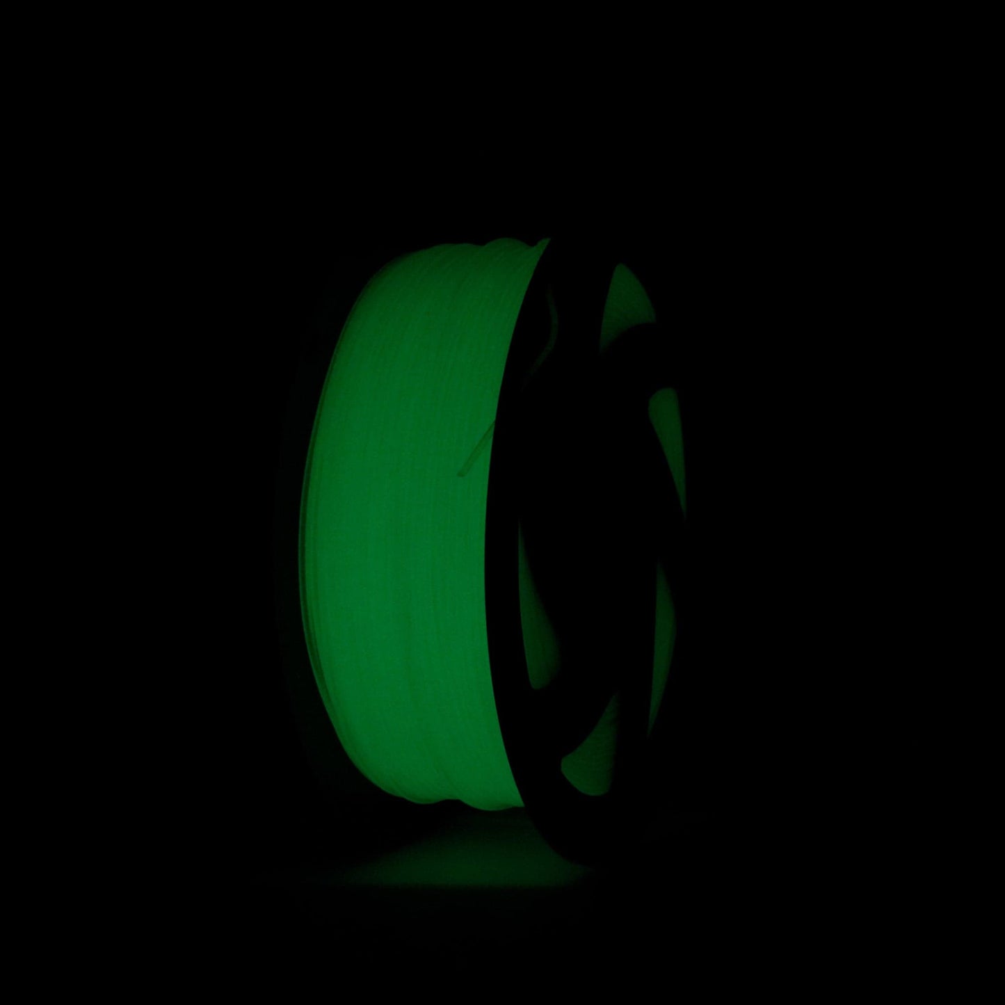 Green Glow PETG Filament 1.75mm shown in the dark